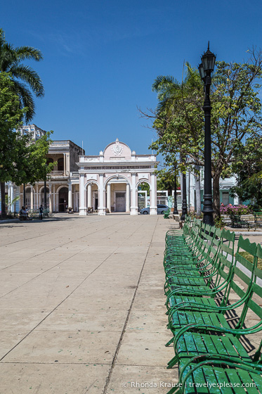 Row of green chairs in a Plaza.
