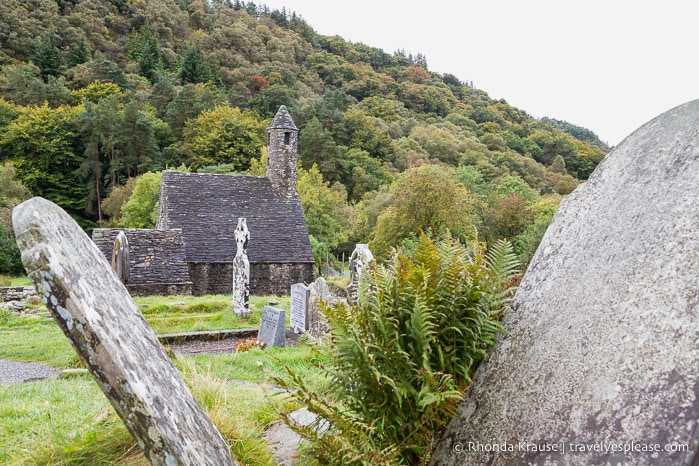 Old tombstones with St. Kevin's Church in the background.
