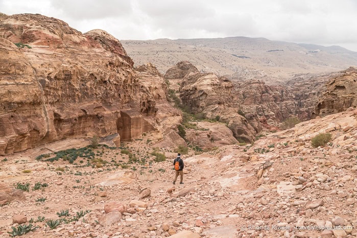 Hiker in the valley on Al-Khubtha Trail.